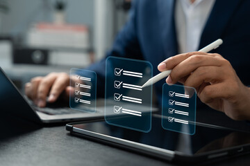 Businessman using stylus on digital checklist interface for task management. Concept of workflow efficiency, quality control, project tracking, digital document process, and business productivity.