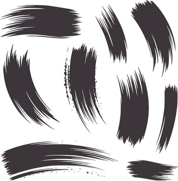 Collection of abstract dark gray ink brush strokes and splatters