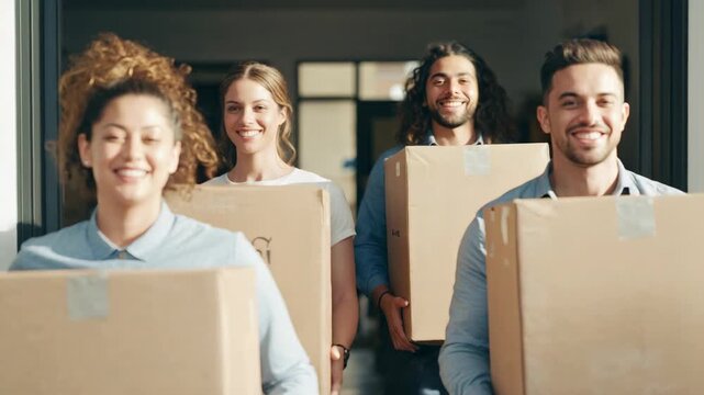 Stepping out of storeroom, four adults in shirts carrying taped boxes to bright door for delivery