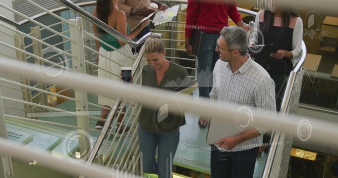 Animation of loading circles and bars over diverse coworkers discussing while walking down stairs