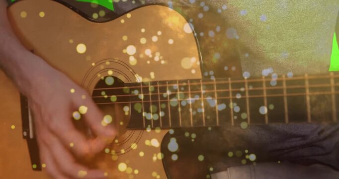 Animated acoustic guitar strings vibrating under strumming hand in close-up, with warm bokeh lights