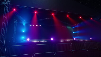 Bright and vibrant lights shine on an empty stage under a starry sky. Colorful beams create a festive atmosphere as it awaits performers and an eager audience to arrive.
