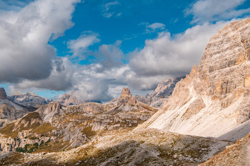 Fototapeta premium View of Antonio Locatelli hut under Tre Cime di Lavaredo and mountain group and blue sky, Dolomite Alps mountains, Trentino Alto Adige, Sudtirol, Dolomites, Italy. Hiking concept.