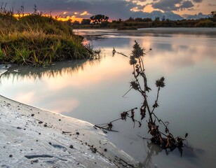 Sunset Reflections on the Tranquil Riverbank Landscape.