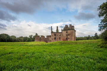 Caerlaverock castle ruins standing in green field in Scotland © Luc V. de Zeeuw