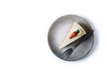 Carrot cake slice with cream cheese frosting isolated on white background. Top view. Copy space