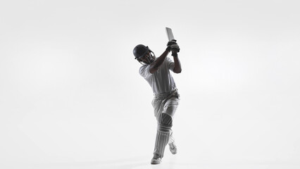 Cricket batsman follow through swing technique in studio isolated on white. Concept of batting...