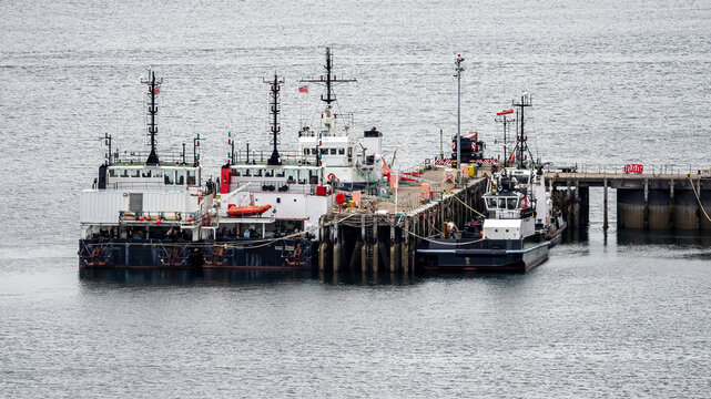 Boats docked at pier in Kyle, Scotland