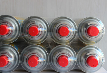Packages of new gas cylinders for portable burners in factory packaging
