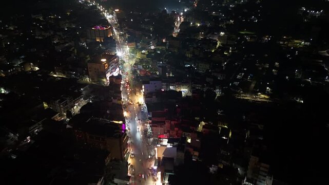 Aerial Night Timelapse of Busy Indian City Street with Flyover and Urban Traffic Flow.