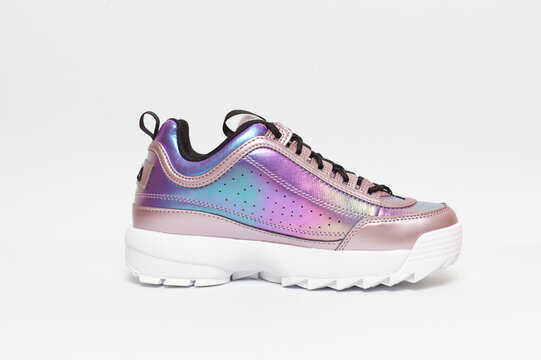 Iridescent holographic Fila Disruptor Sneakers With Chunky White Sole For Trendy Casual Wear on a white background, January 26, 2021 in Valencia, Spain