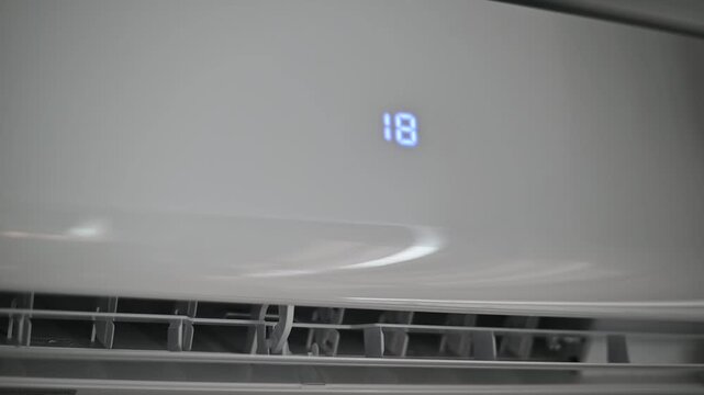 Digital display shows temperature changes over time in an air conditioning unit. Readouts decrease step by step from 21 to 16 degrees. Clear visuals highlight the adjustment