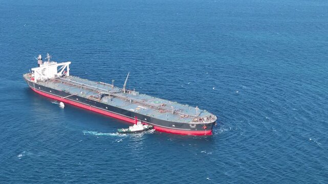 Oil tanker ship. Red Oil Tanker runing in the ocean sea. petroleum ship transportation import export fuel energy across red ocean sea. Vessel transport Gas to customs	
