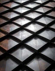 Close-up view of a textured wall or ceiling with a repeating diamond pattern, creating a three-dimensional effect with light and shadow.