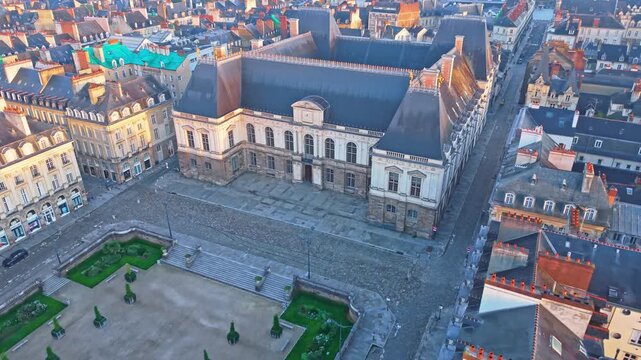 Aerial approach to Parlement de Bretagne courthouse and surrounding historic city center in Rennes, establish
