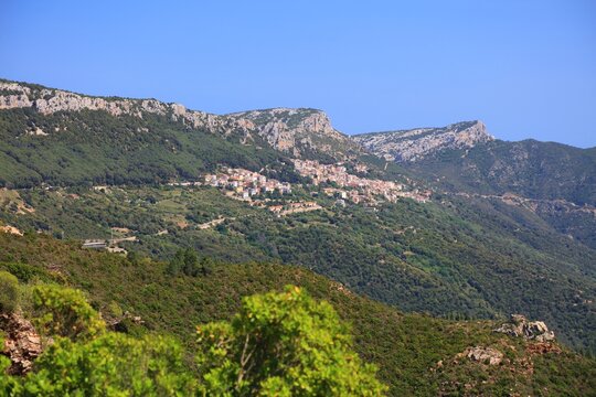 Sardinia inland mountain landscape of Supramonte mountains near Baunei. May in Sardinia. Dorgali town in distance.