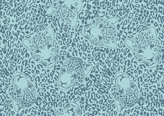 Seamless blue leopard pattern with heads and spots. Jaguar face vector background. Teal cheetah skin textile design. © RDYD Studio