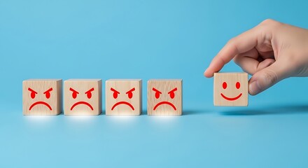 Positive Transformation and Experience Design Concept with Hand Selecting Smiling Emoji Block from Row of Frustrated Faces