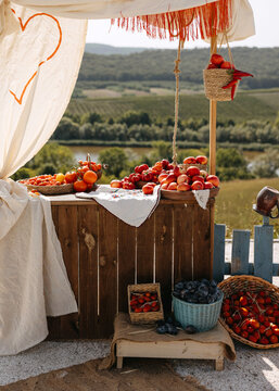 Rustic Outdoor Fruit Market Stand in Countryside Landscape