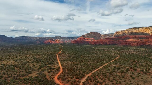 Flying Over The Hiking Trails Towards The Sandstone Cayon Formations In Sedona, Arizona, USA. - aerial hyperlapse
