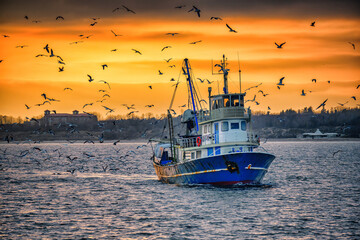 Fishing boat at sunset