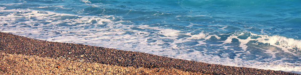 Sea wave foam on the beach, sea surf, waves, sea shore.