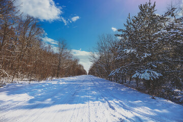 Winter country road covered with snow