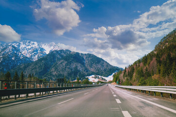 Driving a car on the autobahn between the mountains in Slovenia