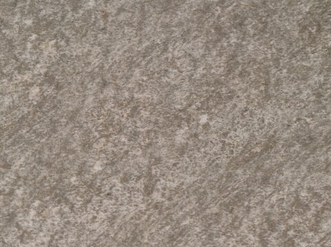 textured natural stone paving, weathered gray sandstone tiles enhance outdoor pathways and patios