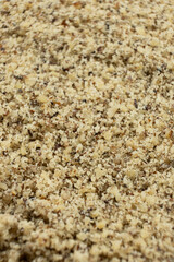 Fototapeta premium Detailed texture background of ground walnut kernels