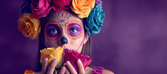 Obraz premium Young woman with painted Day of the Dead face and flower crown