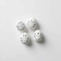 Decorative Easter Eggs with Hand-Drawn Designs of Rabbits and Flowers on White Background