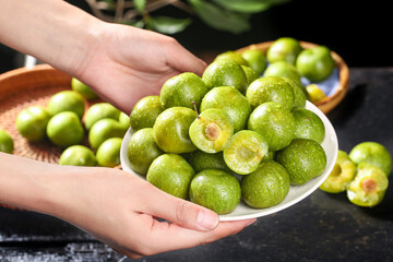 Fresh Green Plums with Pits in Hands - Healthy Sichuan Produce