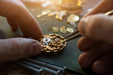 Mechanical watch repair. Watchmaker is repairing the mechanical watches
