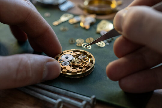 Mechanical watch repair. Watchmaker is repairing the mechanical watches