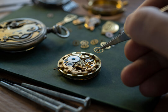 Mechanical watch repair. Watchmaker is repairing the mechanical watches