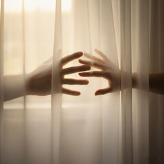 Valenstine day Hands reaching through sheer curtains towards sunlight