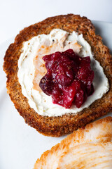 Open Sandwich with leftover turkey slices with cranberry sauce on top. Perfect holiday breakfast or lunch