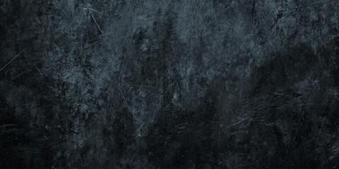 Fototapeta premium Dramatic dark wall concrete texture with heavy scratches weathered grit deep scratches, scuffs, and a weathered concrete appearance.