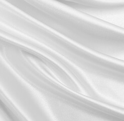 Fototapeta premium Smooth elegant white silk or satin luxury cloth texture as wedding background. Luxurious background design