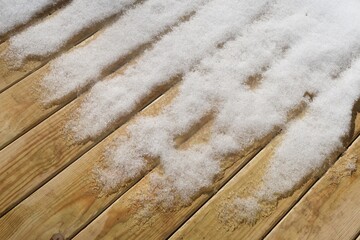 Snow melting on the backyard deck | Snow covered deck