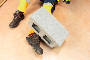 Male body lying on the floor after a work accident.