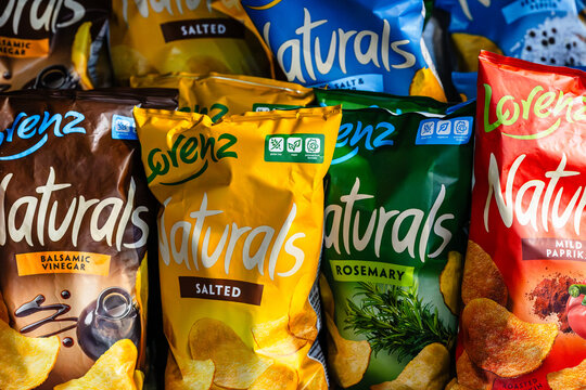 DA NANG, VIETNAM - january 01, 2026: Assorted flavors of lorenz naturals potato chips in vibrant packaging