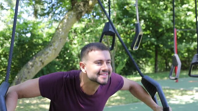 Handsome man working out in the park 