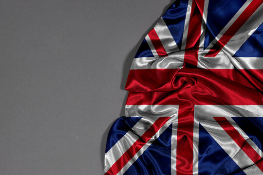 Union Flag or Union Jack the united kingdom flag representing a unified Great Britain of Wales, Scotland, Northern Ireland & England, combining the patron saint crosses waving in a gentle breeze