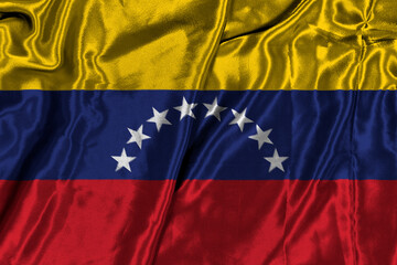 Obraz premium Vibrant Venezuelan National Flag Waving In Prideful Light Across Yellow Blue Red Stripes