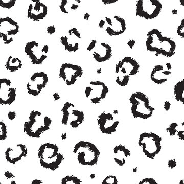 Cheetah leopard or jaguar skin pattern. Seamless black and white design for textile clothing and web usage. Grunge brush used, all hand drawn elements.