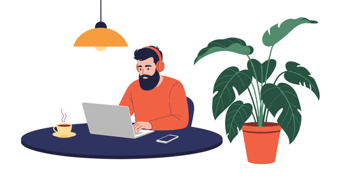 Man with a beard wearing headphones and working on a laptop at a round table next to a large potted monstera houseplant.