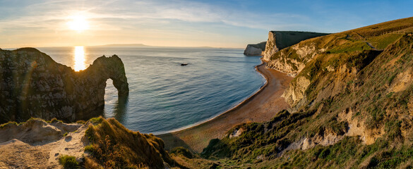 Durdle Door sea arch at sunset Dorset England