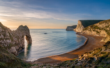 Durdle Door sea arch at sunset Dorset England